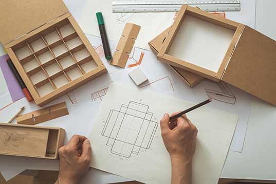The DesignWorks process begins with a thorough review of each client’s vision and limitations. Using this information, we develop preliminary design concepts, refining them based on client feedback. Once all parties are satisfied with the design, we move to the engineering phase, where we develop detailed 3D mockups of the proposed packaging. These designs help us build and analyze prototypes of the final design, altering details as necessary to perfect each layer. Prototyping gives clients full confidence that the design will look and perform as they imagine it. Finally, we move into production, leveraging state-of-the-art equipment to manufacture high-quality packaging at any necessary volume.